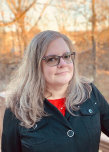 Ely-outdoor-headshot.jpg-1 Ely-outdoor-headshot.jpg-1